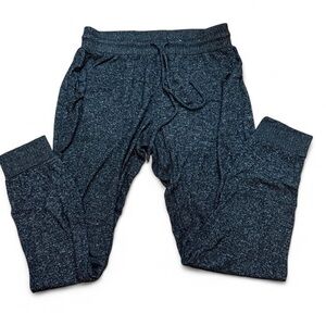 Grey and white stars above sweatpants. Size small.